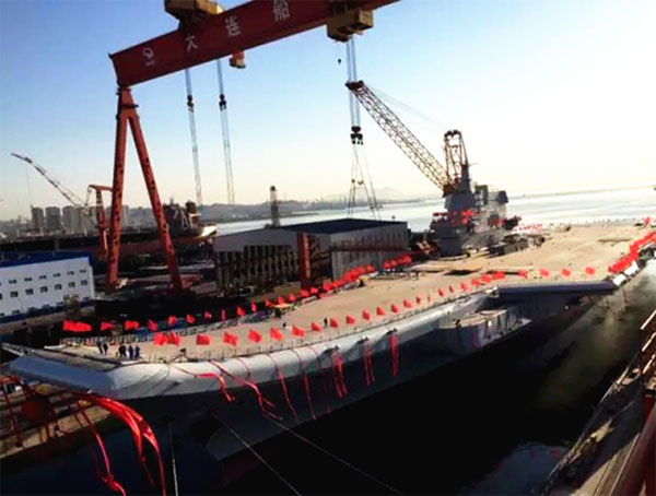 英语热词 | 中国首艘国产航母下水（first home-built aircraft carrier hit the water）